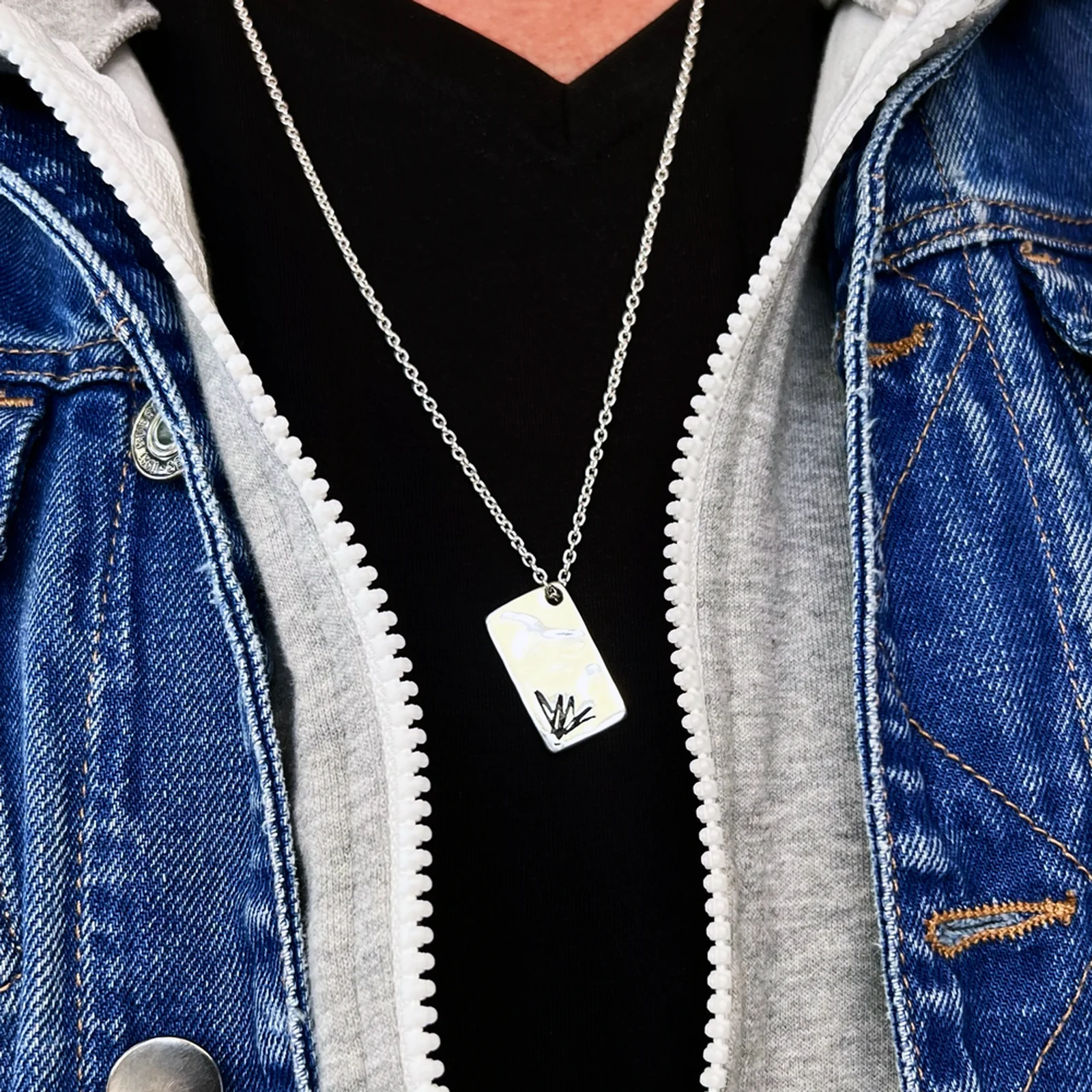 Chris Cornell memorial rectangle necklace worn with a denim jacket
